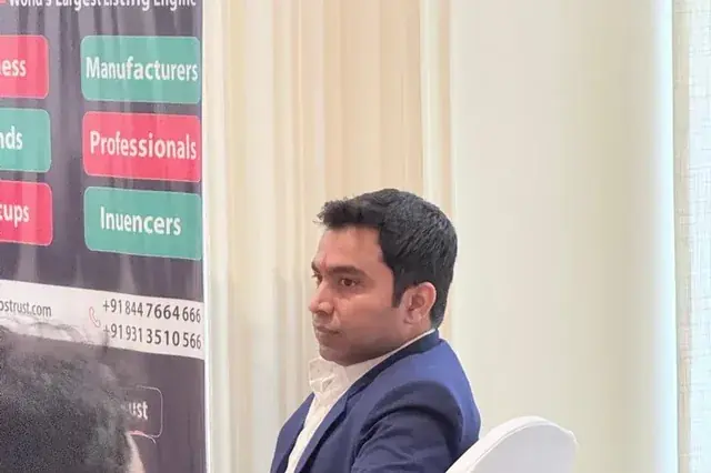 Chirag Arora at a ClipsTrust event, seated at a networking table