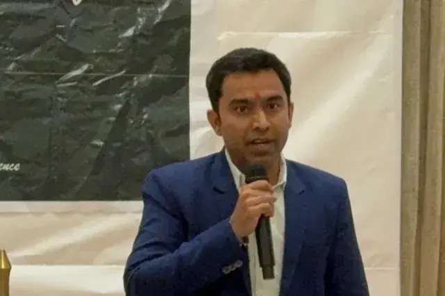 Chirag Arora speaking with a microphone at a marketing event